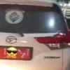 Mobil plat merah isi pertalite