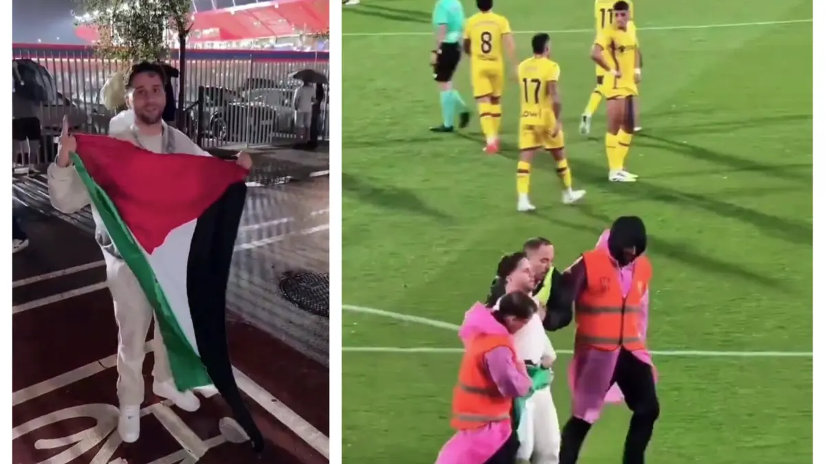 fans yang membawa bendera Palestina
